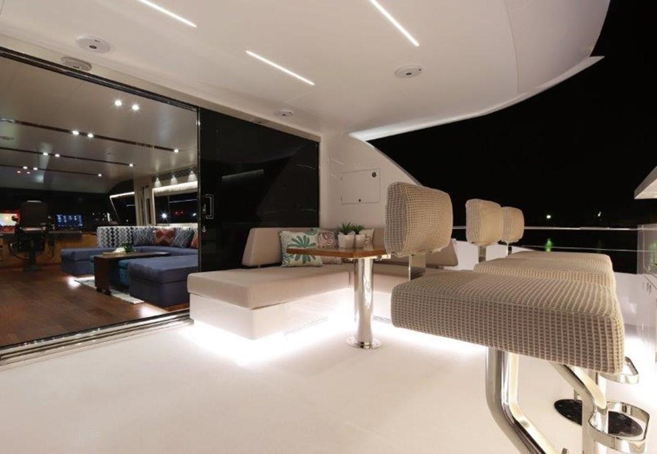 a room with a table and chairs aboard CROWNED EAGLE Yacht for Sale