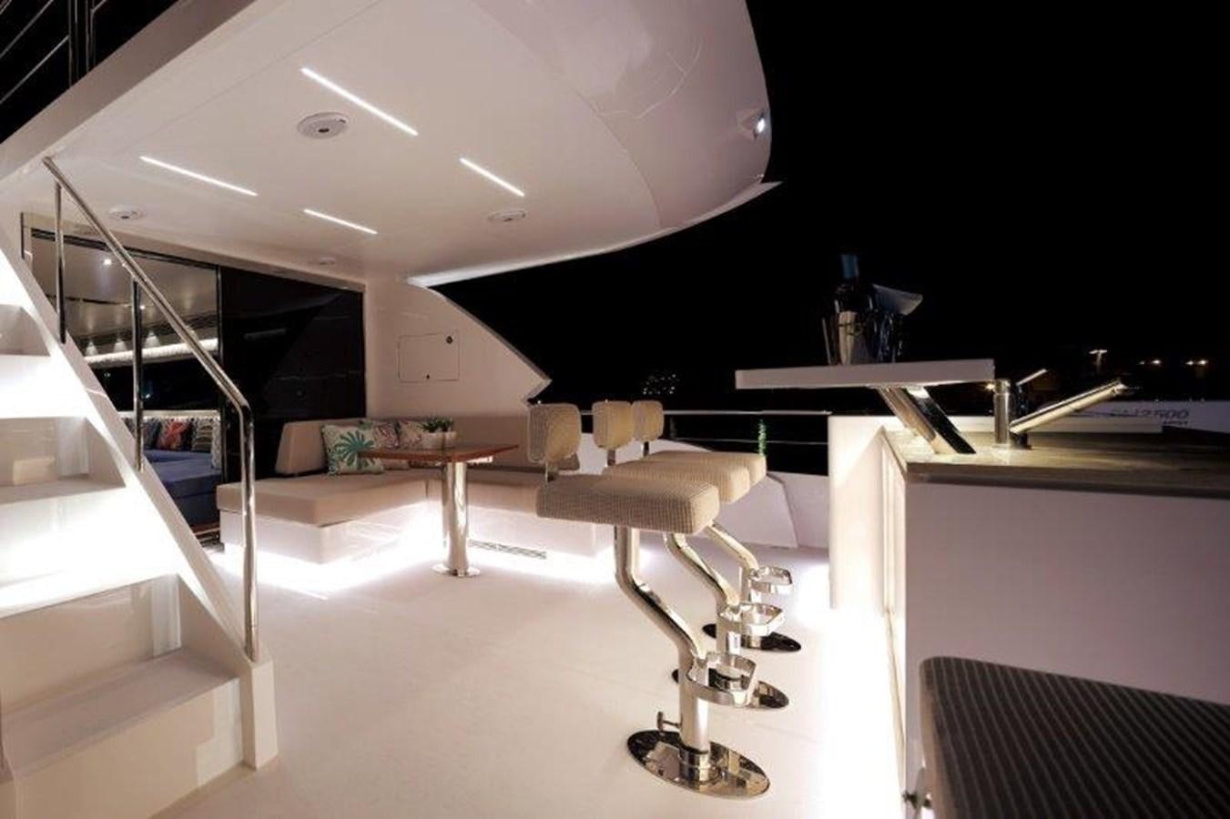 a room with a table and chairs aboard CROWNED EAGLE Yacht for Sale