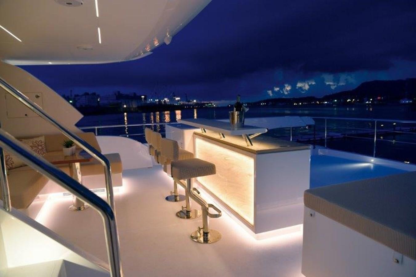 a room with a view of the ocean and a large building aboard CROWNED EAGLE Yacht for Sale