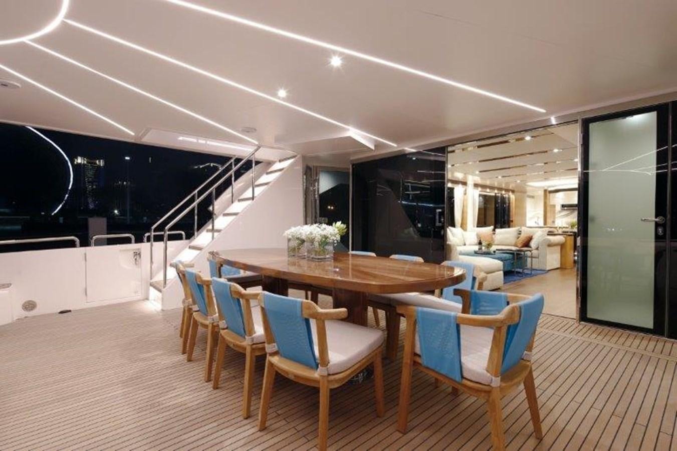 a dining room with a table and chairs aboard CROWNED EAGLE Yacht for Sale