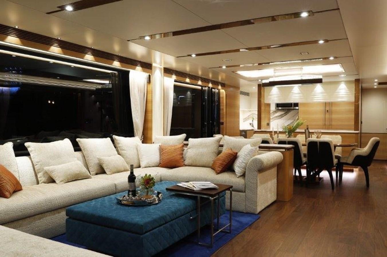 a living room with a couch and a table aboard CROWNED EAGLE Yacht for Sale