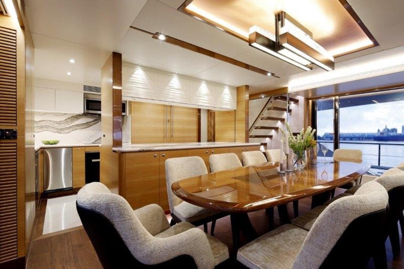 a large open kitchen and dining area aboard CROWNED EAGLE Yacht for Sale
