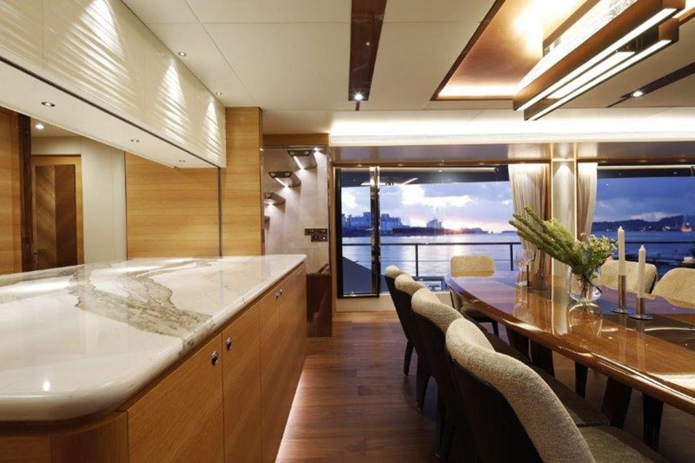 a kitchen with a large window aboard CROWNED EAGLE Yacht for Sale