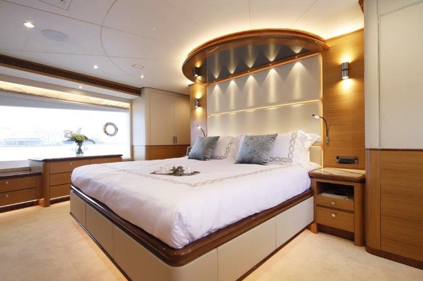 a bed in a room aboard CROWNED EAGLE Yacht for Sale