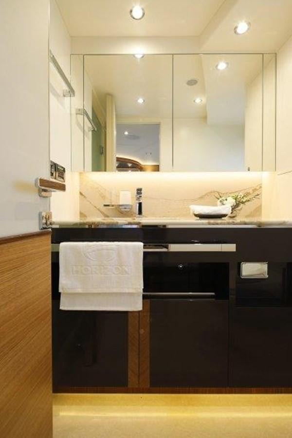 a bathroom with a large mirror aboard CROWNED EAGLE Yacht for Sale