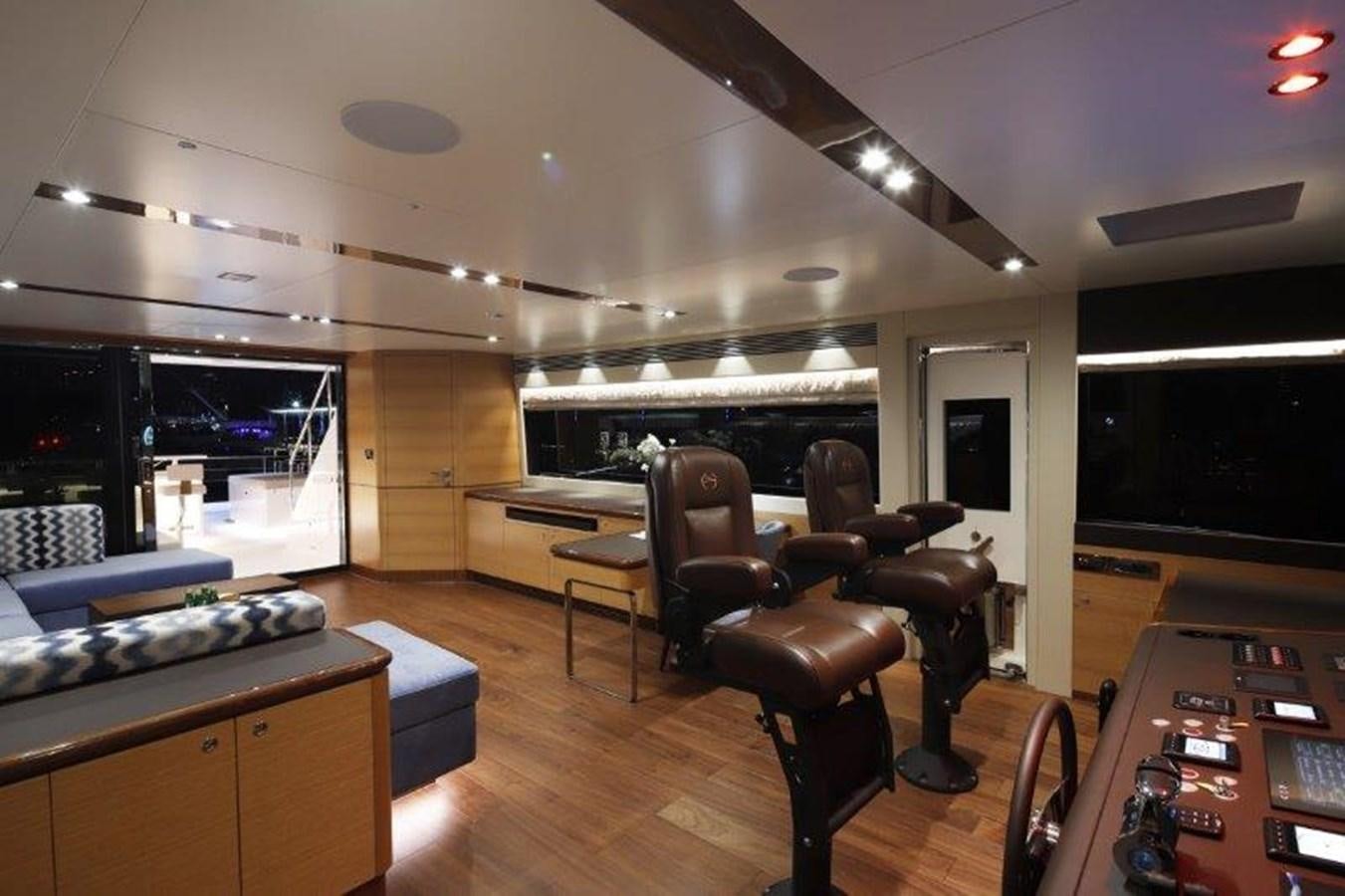 a room with a desk and chairs aboard CROWNED EAGLE Yacht for Sale