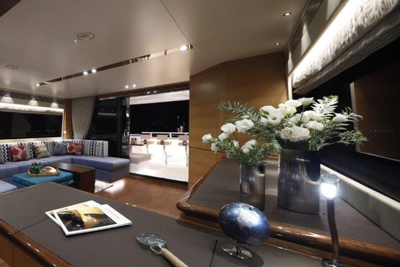 a living room with a large mirror aboard CROWNED EAGLE Yacht for Sale