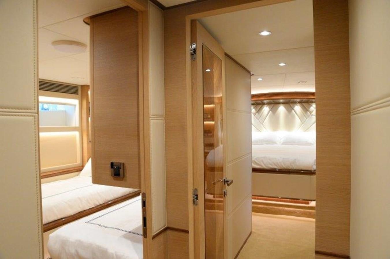 a room with a bed and a door aboard CROWNED EAGLE Yacht for Sale