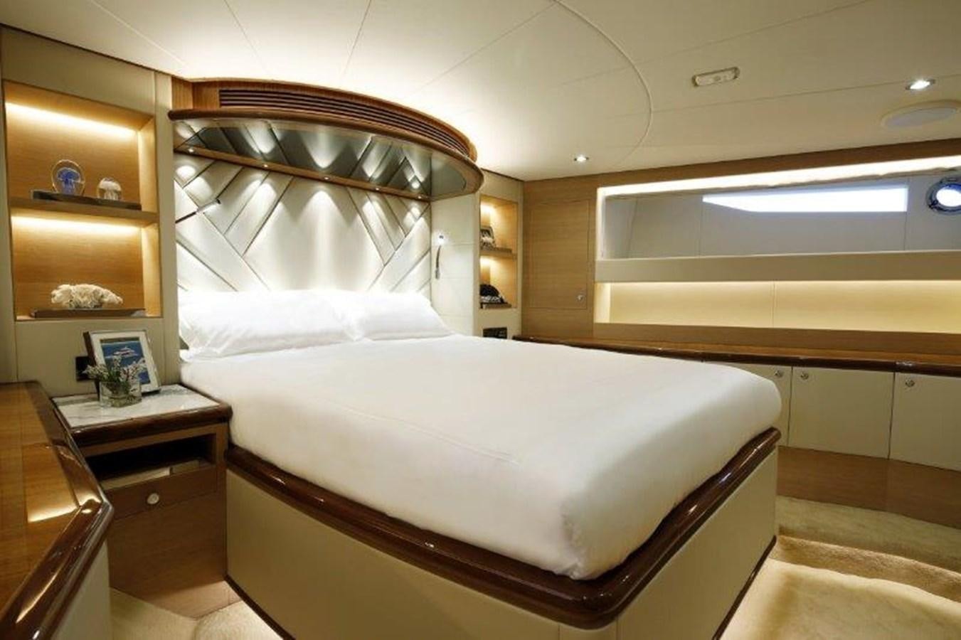 a bed in a room aboard CROWNED EAGLE Yacht for Sale