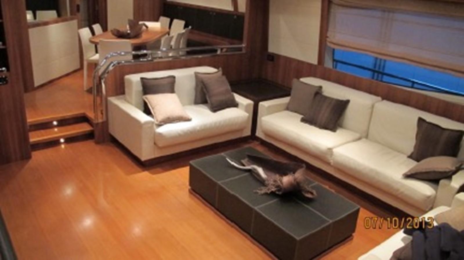 a living room with a couch and a table aboard SPYRO Yacht for Sale