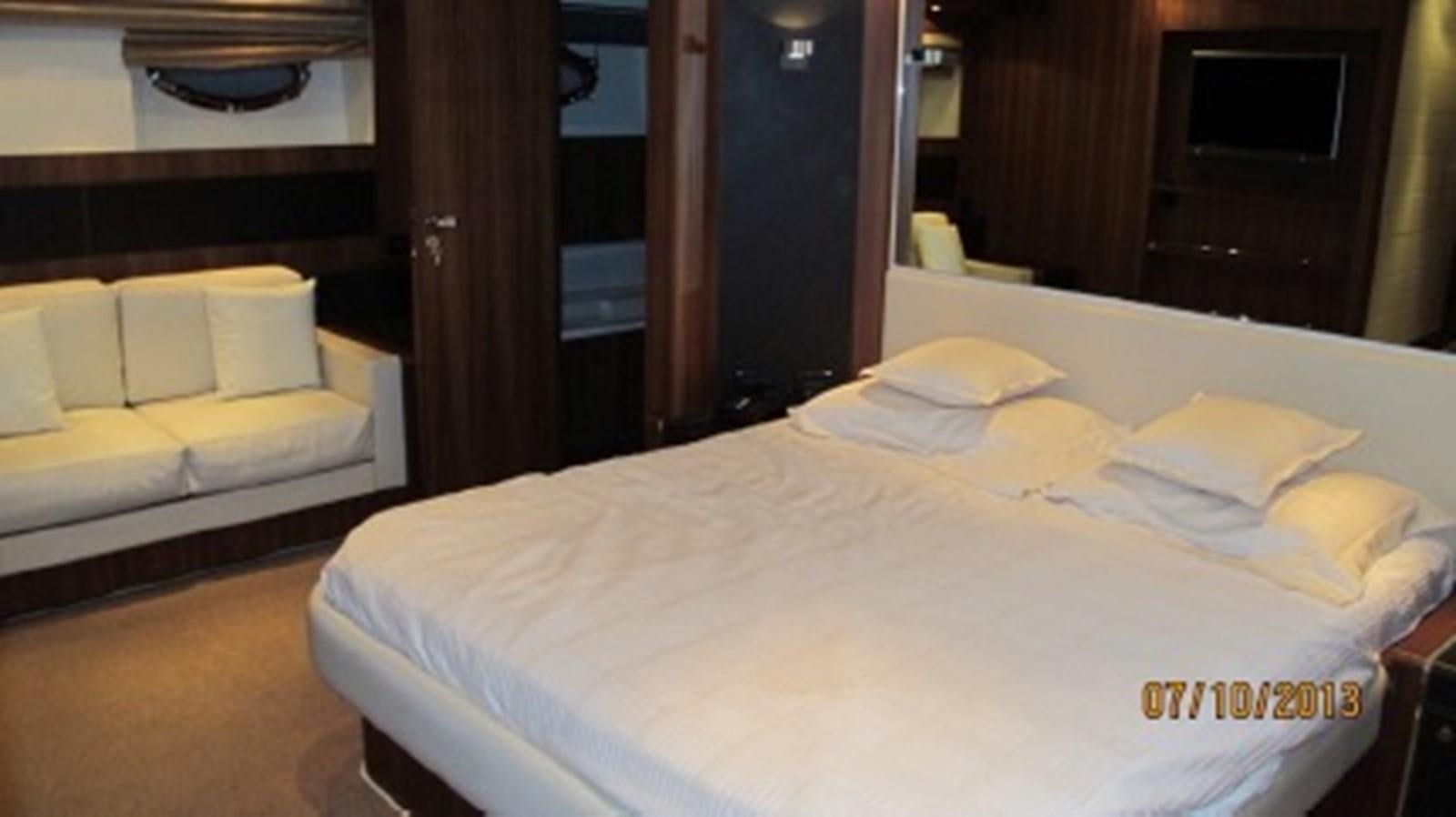 a room with a bed and a couch aboard SPYRO Yacht for Sale