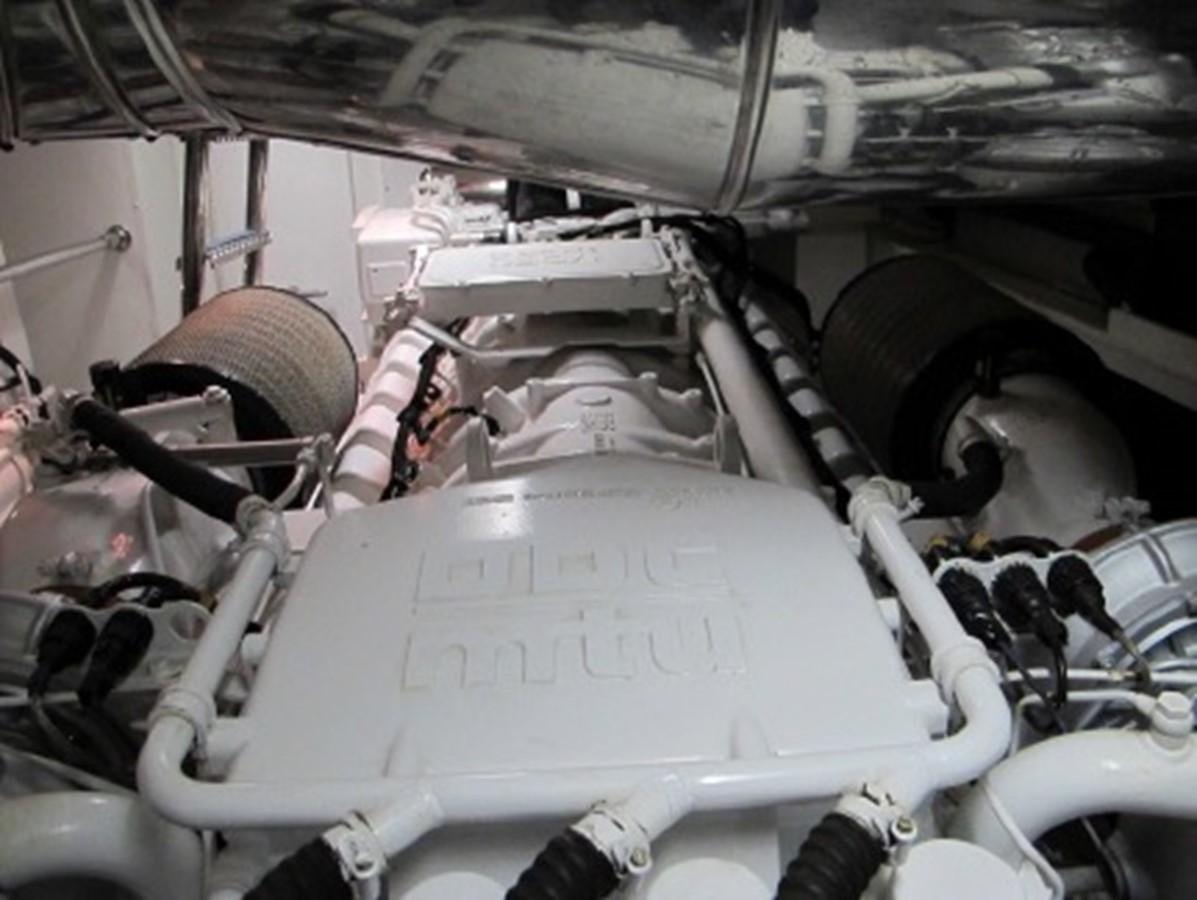a car with a large engine aboard SPYRO Yacht for Sale