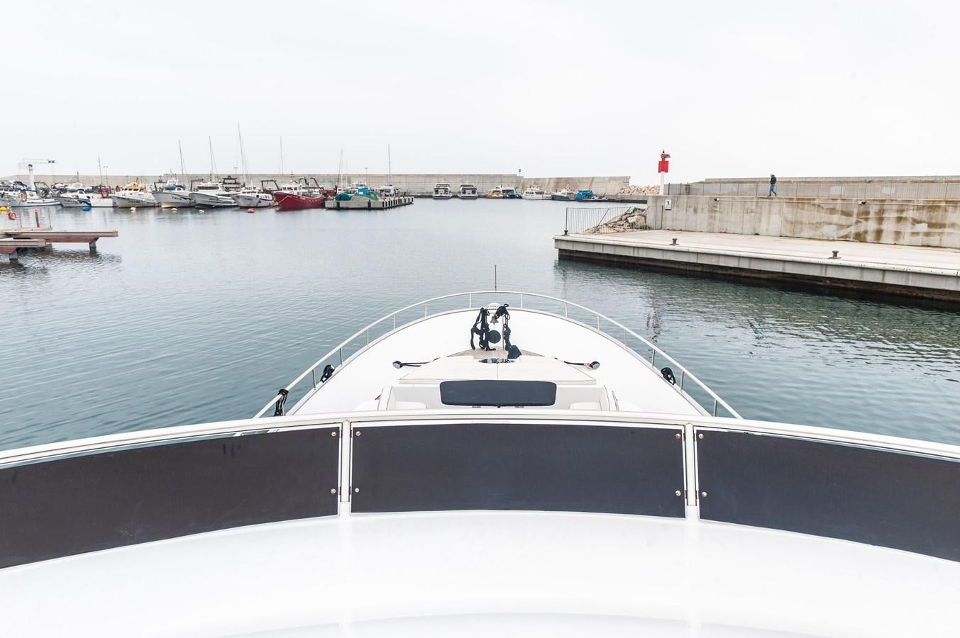 a white boat in a body of water aboard ANGELS Yacht for Sale