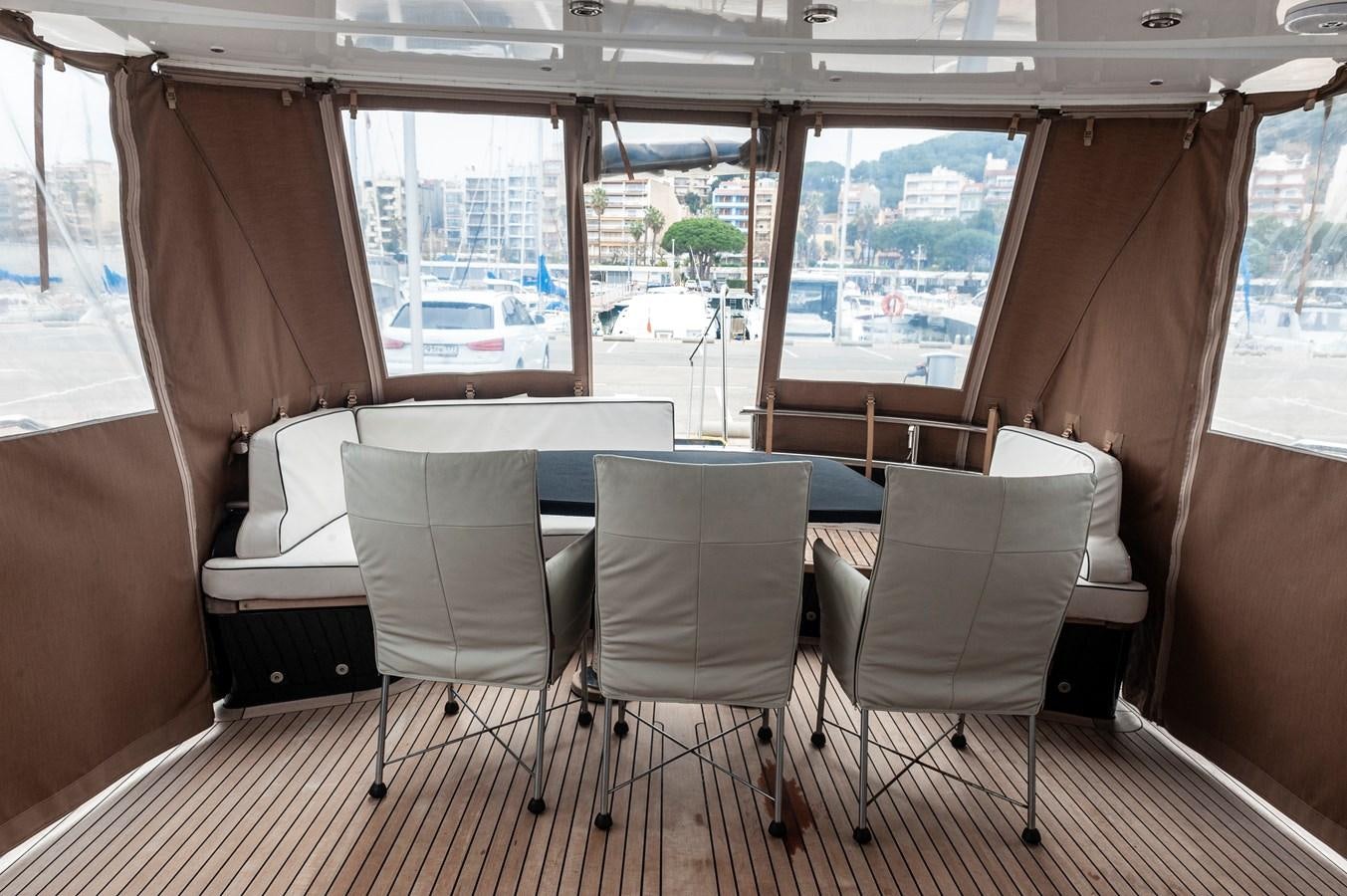 a room with chairs and a table aboard ANGELS Yacht for Sale