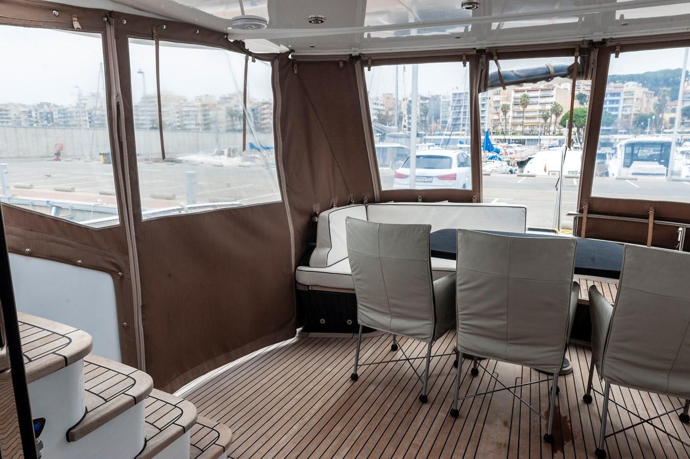 a room with a table and chairs aboard ANGELS Yacht for Sale