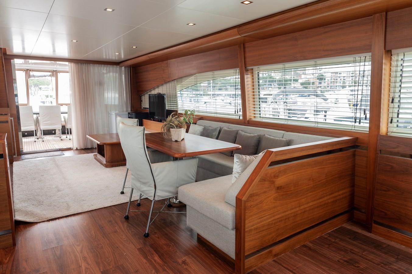 a living room with a couch and a table aboard ANGELS Yacht for Sale