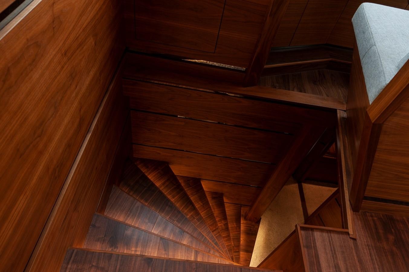 a wooden staircase with wooden floors aboard ANGELS Yacht for Sale