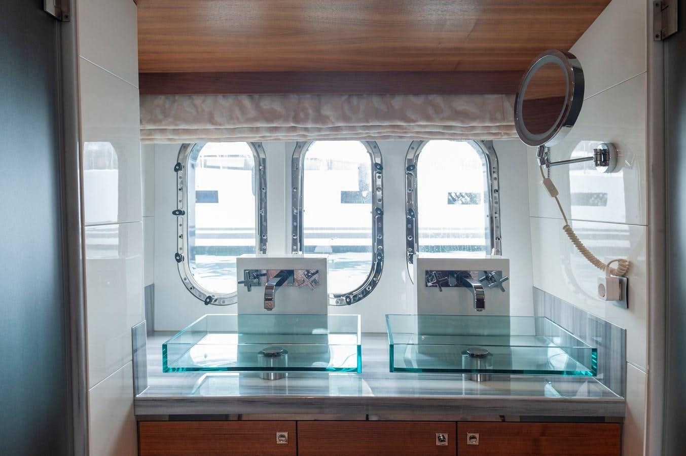 a bathroom with a large mirror aboard ANGELS Yacht for Sale