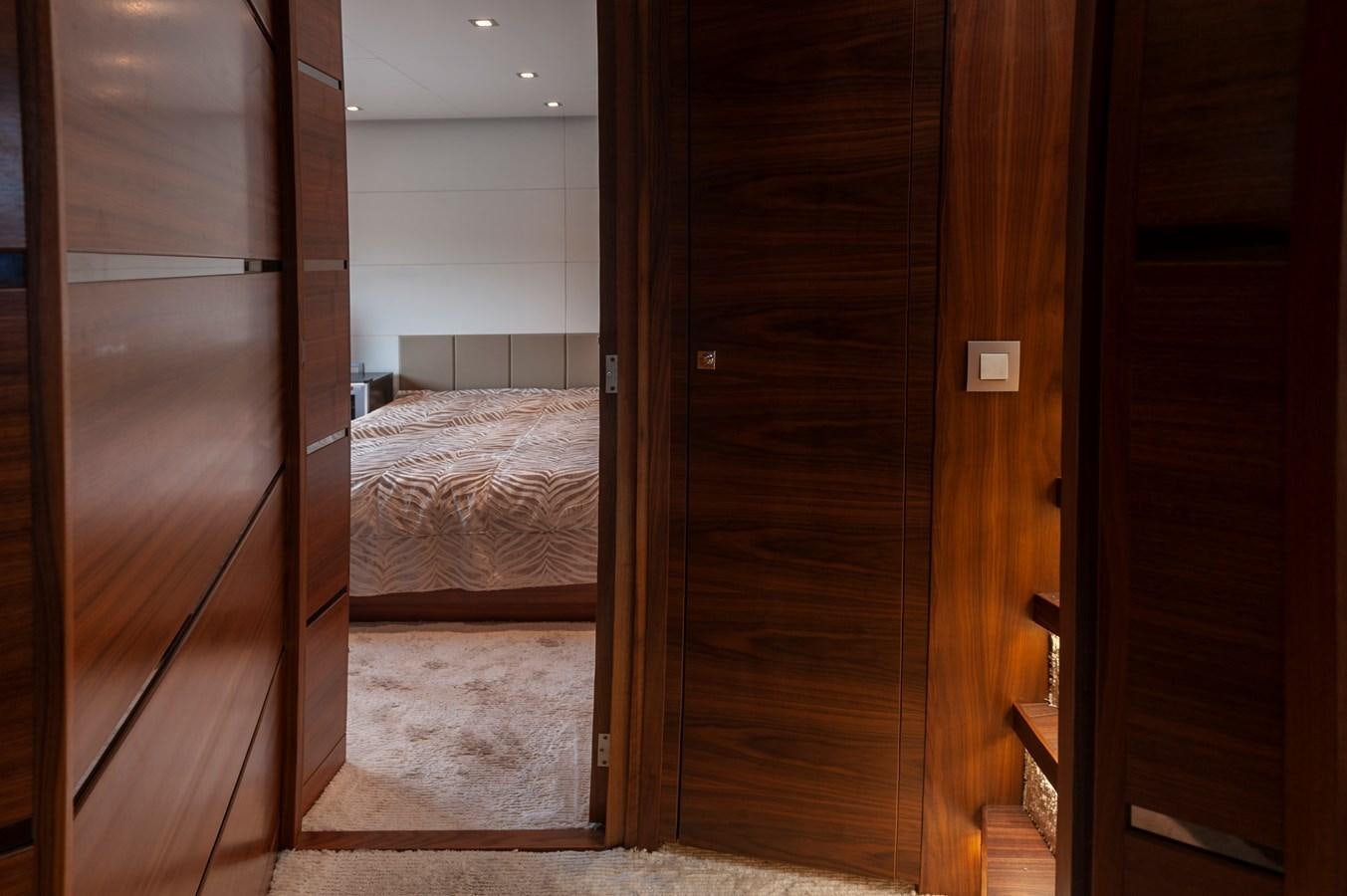 a room with a bed and a closet aboard ANGELS Yacht for Sale