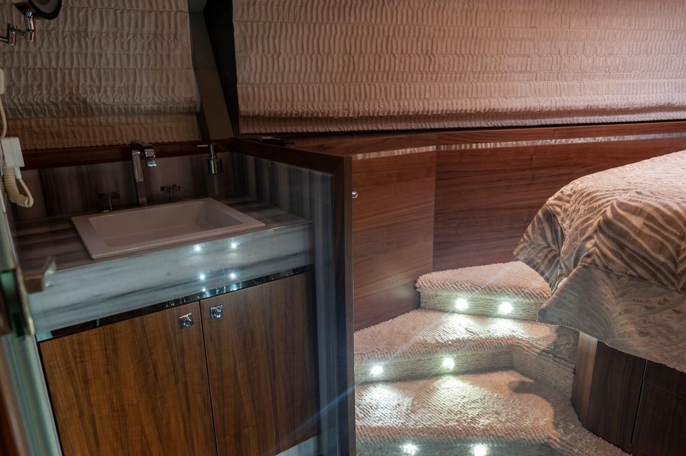 a bathroom with a sink and a bed aboard ANGELS Yacht for Sale