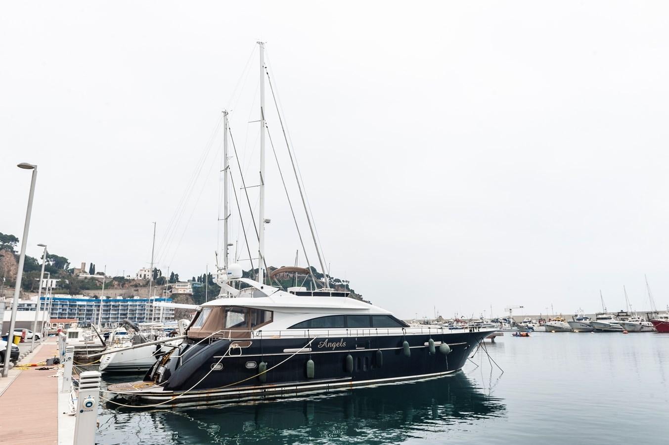 a boat docked at a pier aboard ANGELS Yacht for Sale