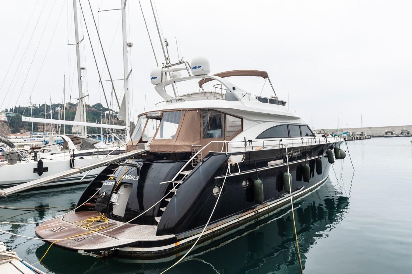 a boat is parked in the water aboard ANGELS Yacht for Sale