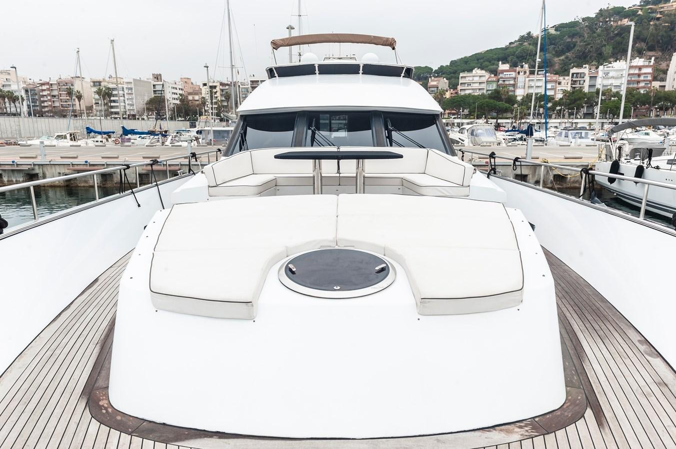 a white yacht on a dock aboard ANGELS Yacht for Sale