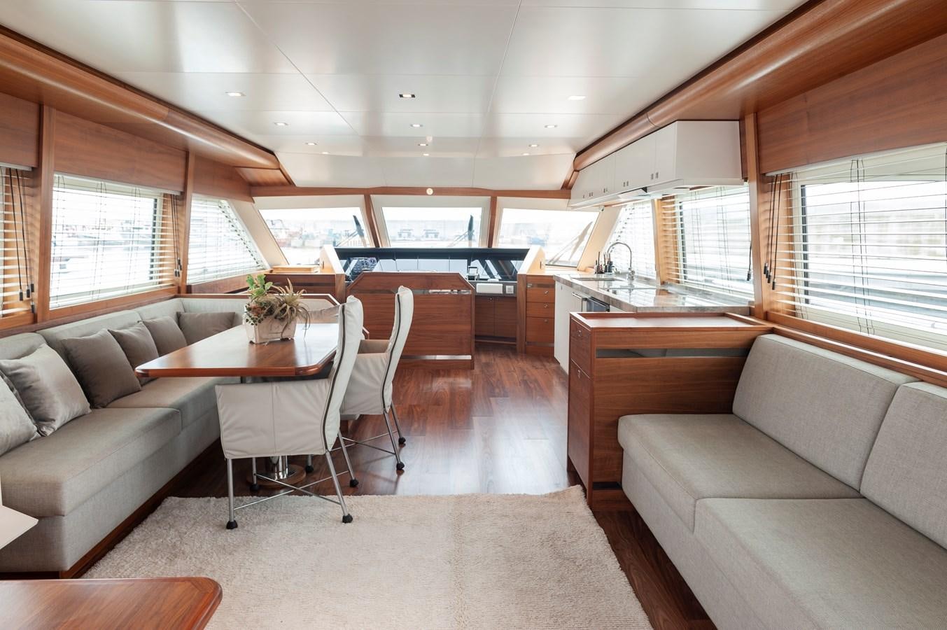 a living room with a couch and a table aboard ANGELS Yacht for Sale