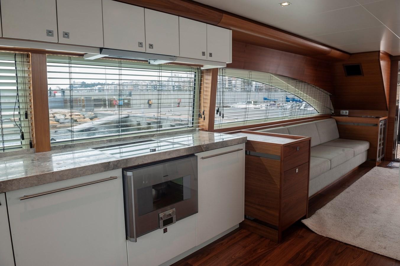 a kitchen with a large window aboard ANGELS Yacht for Sale