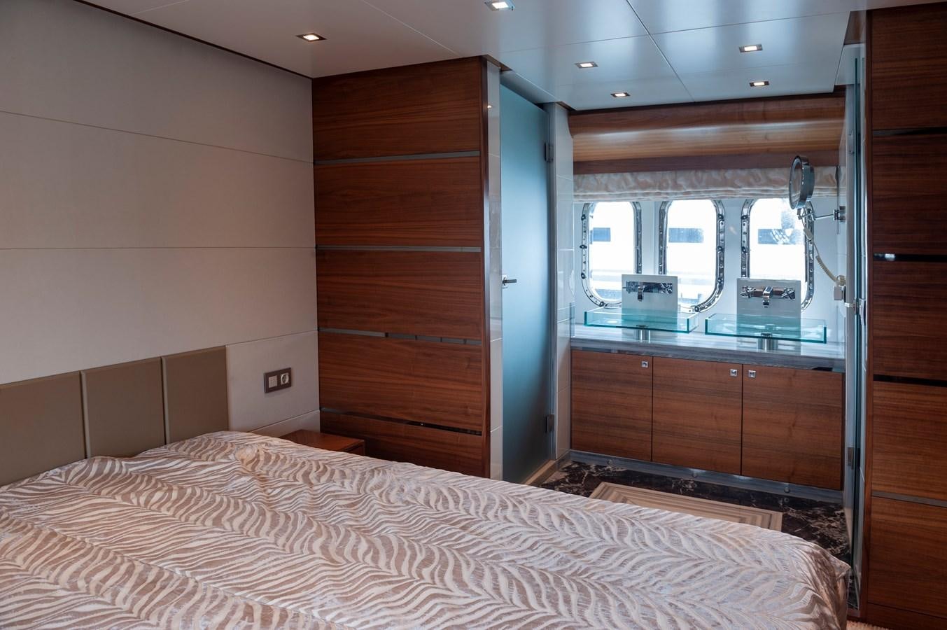 a bedroom with a bed and a closet aboard ANGELS Yacht for Sale