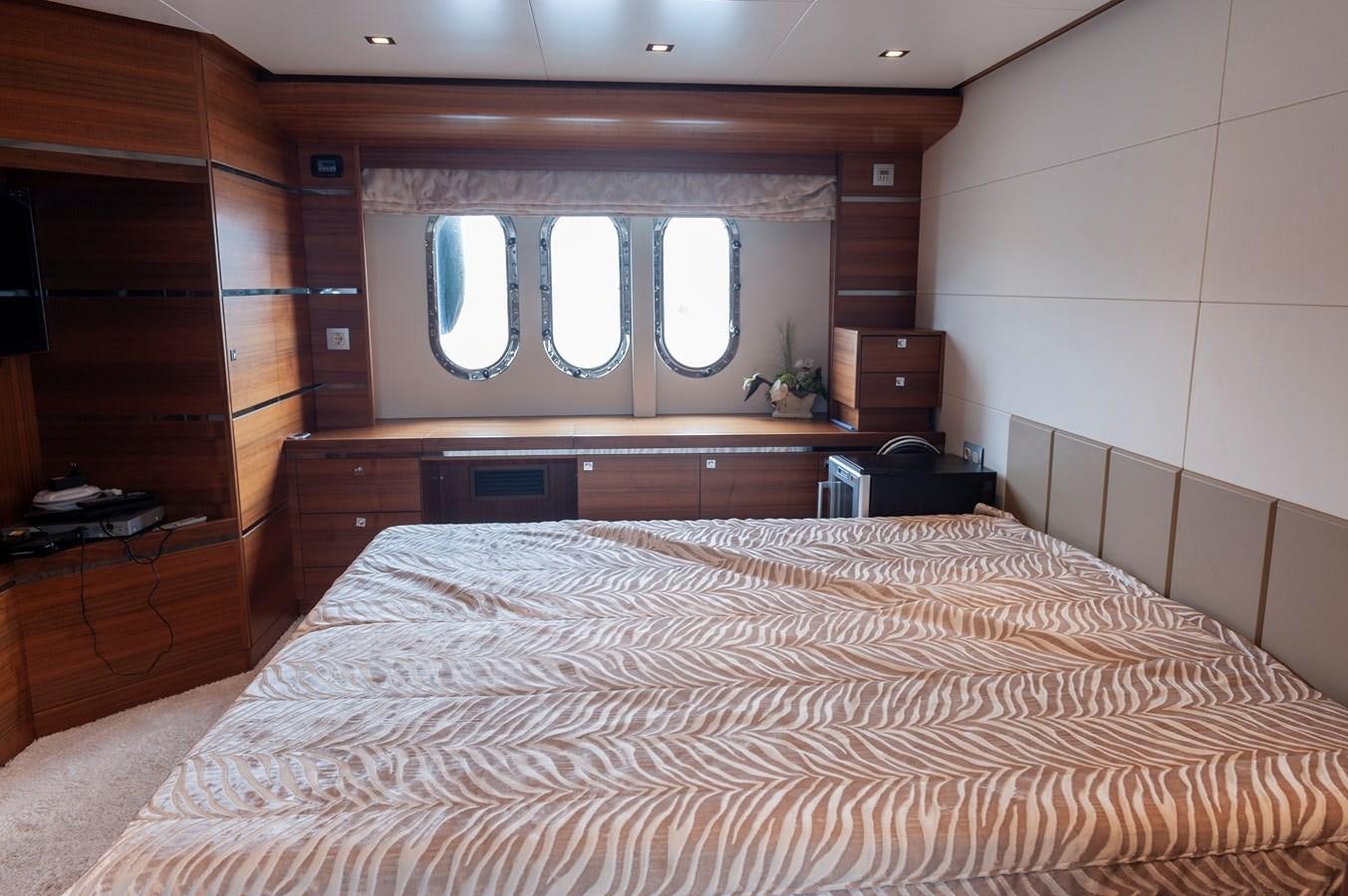 a bed with a mirror above it aboard ANGELS Yacht for Sale