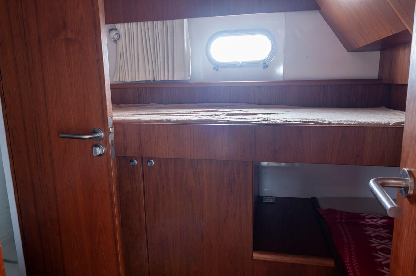 a room with a cupboard and a window aboard ANGELS Yacht for Sale