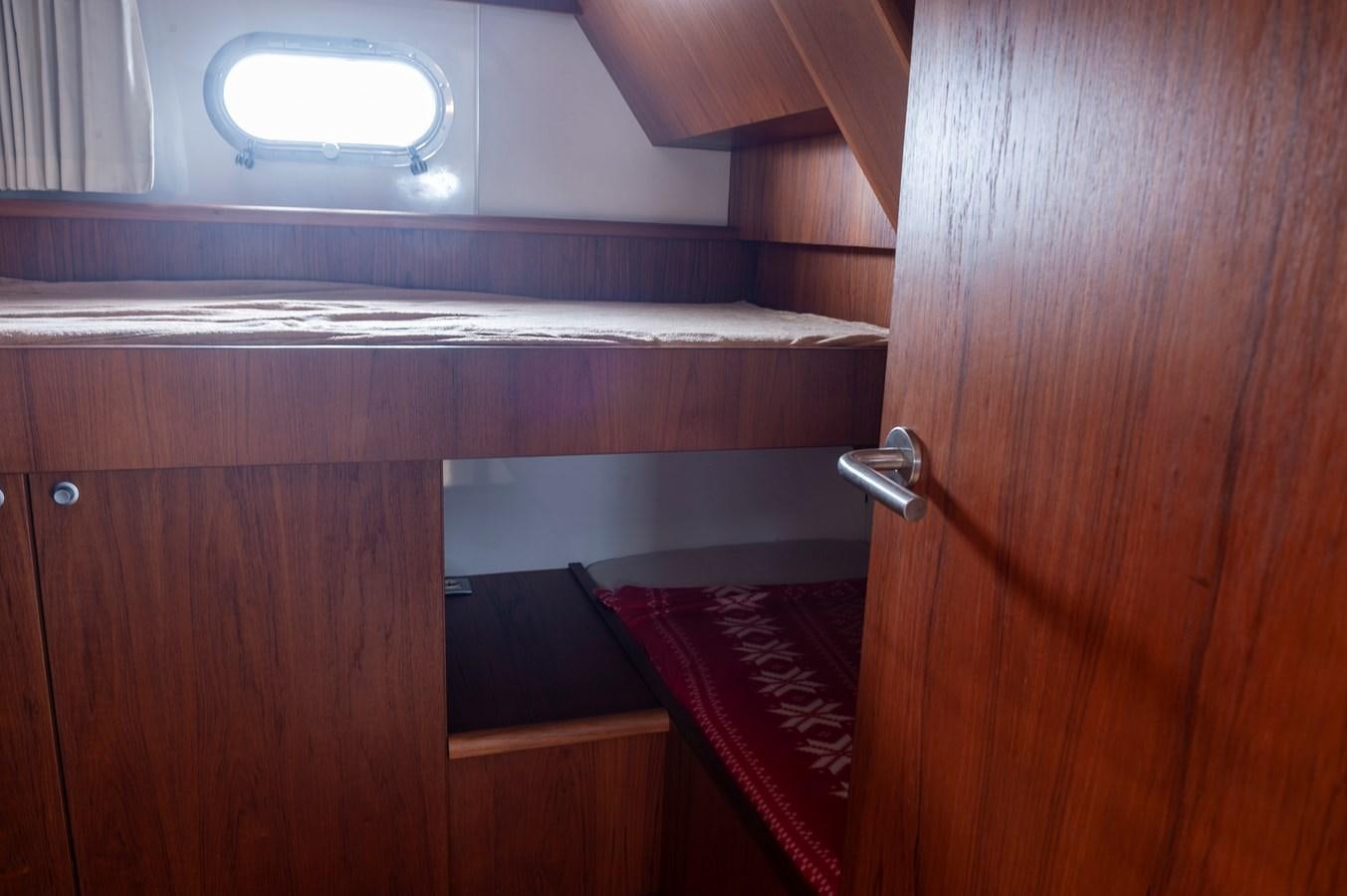 a wooden cabinet with a light above it aboard ANGELS Yacht for Sale