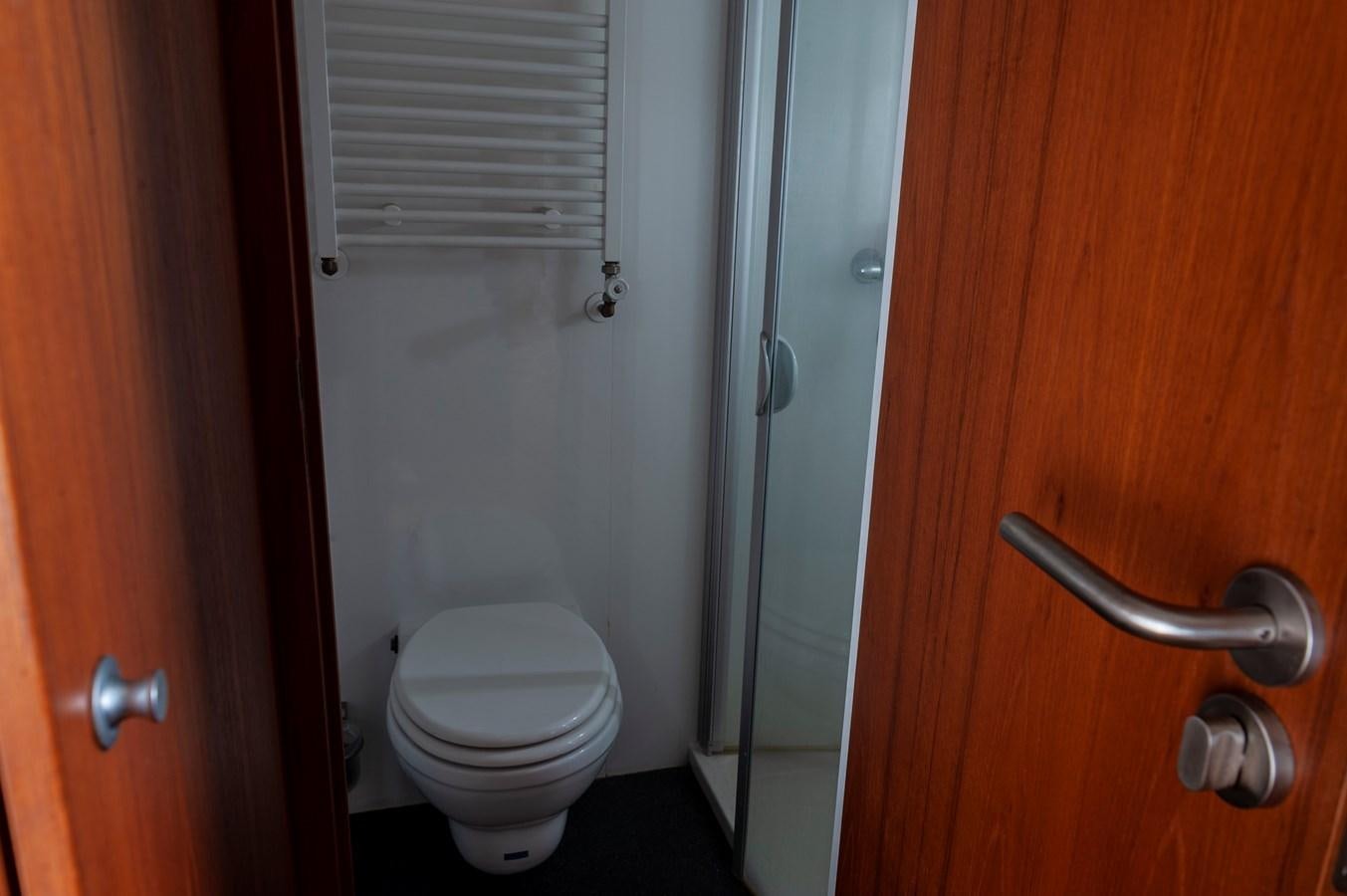 a toilet in a bathroom aboard ANGELS Yacht for Sale