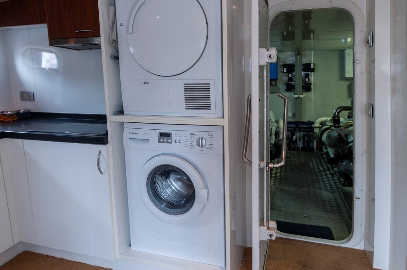 a washer and dryer in a room aboard ANGELS Yacht for Sale