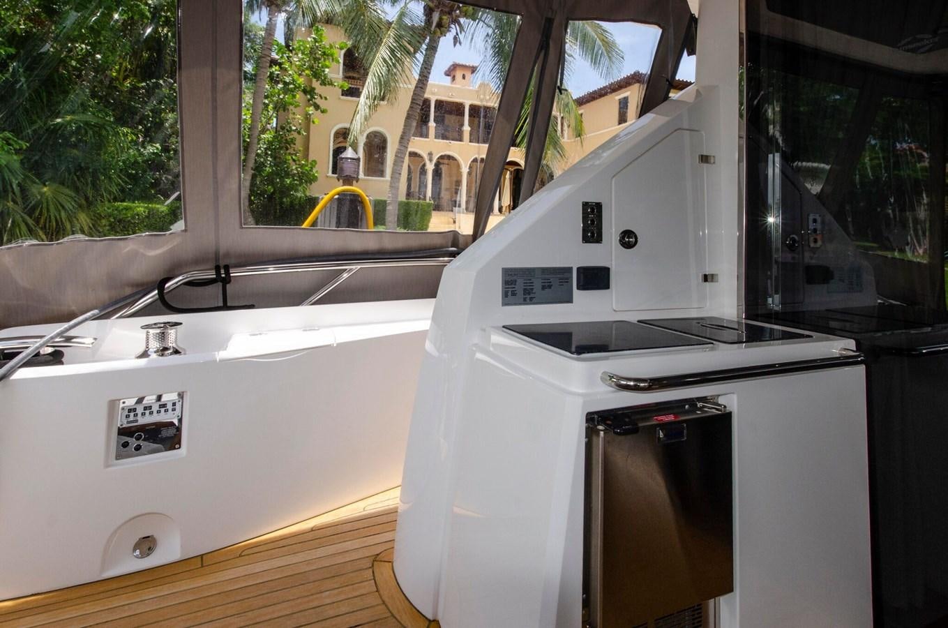 a kitchen with a large window aboard SECOND THOUGHTS Yacht for Sale
