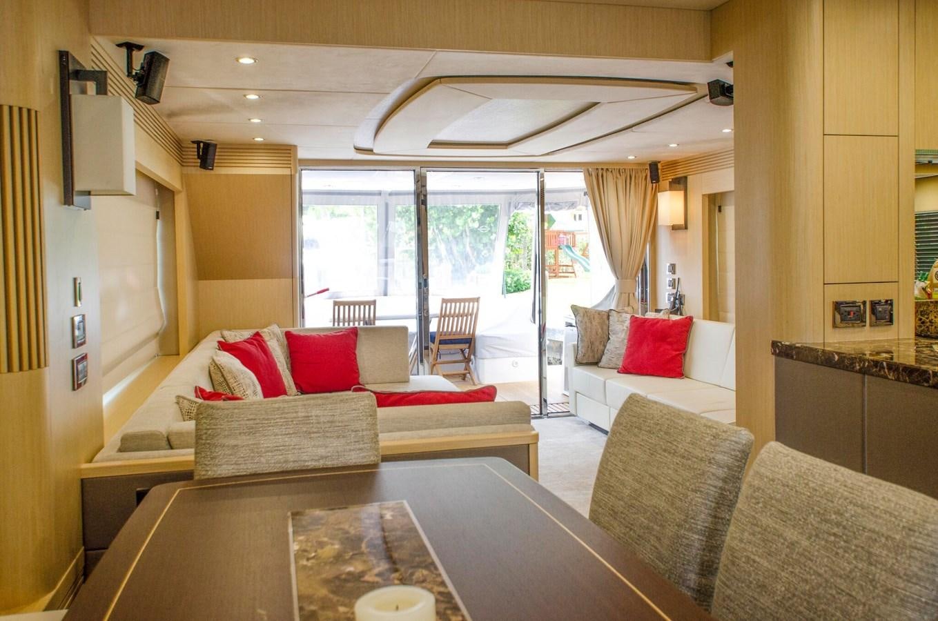 a living room with a table and couches aboard SECOND THOUGHTS Yacht for Sale