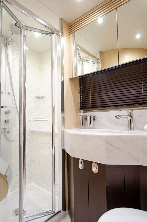 a bathroom with a shower and sink aboard SECOND THOUGHTS Yacht for Sale