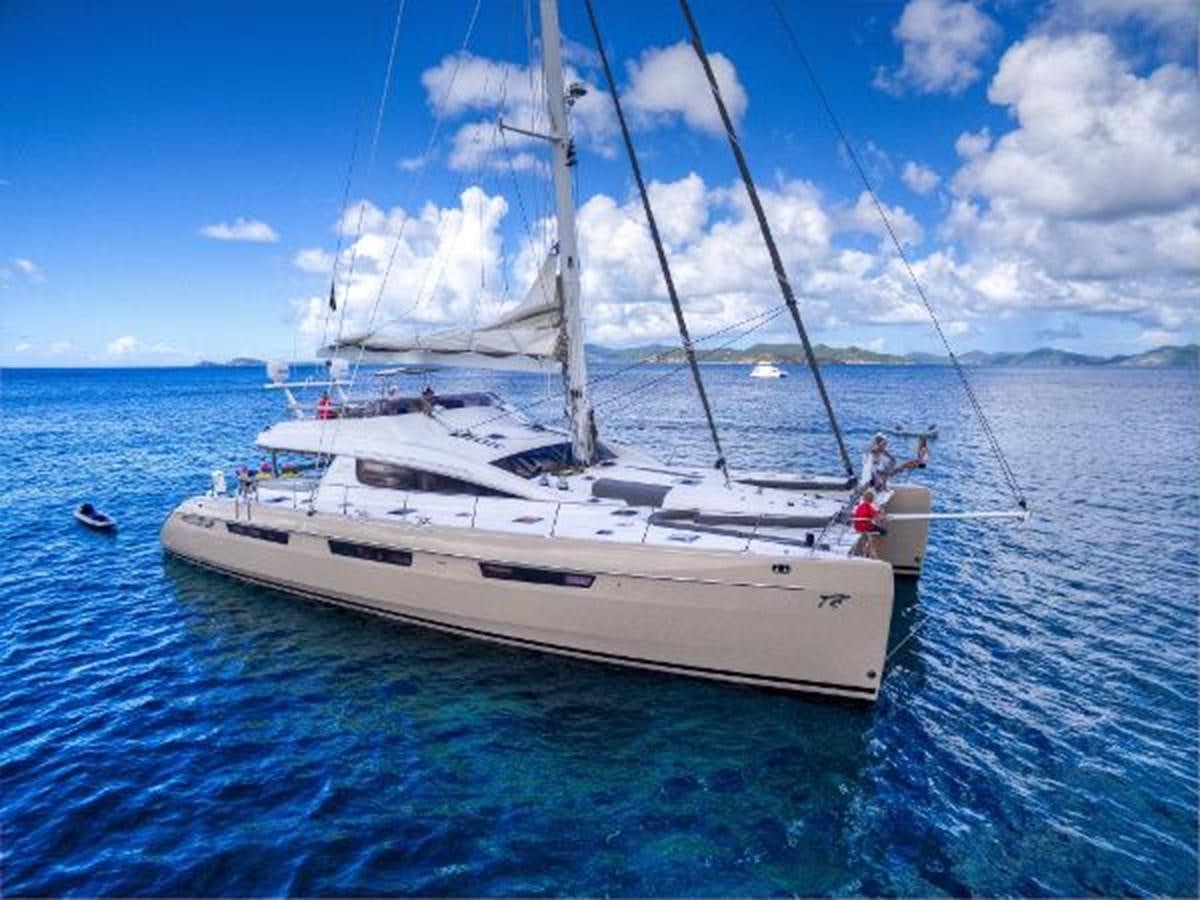 a white boat in the water aboard 74' PRIVILEGE 2010 Yacht for Sale