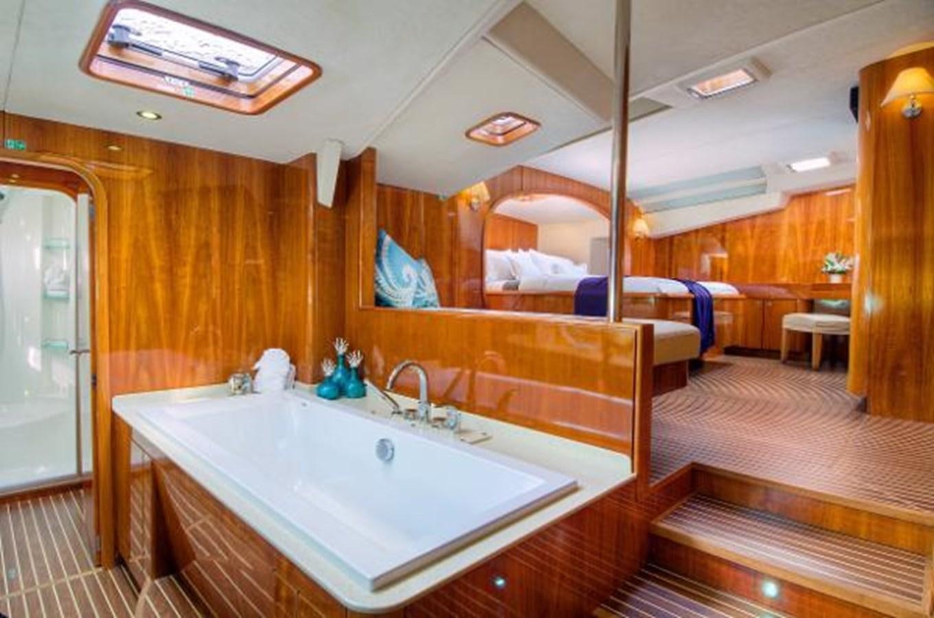 a large bathroom with a large bathtub aboard 74' PRIVILEGE 2010 Yacht for Sale