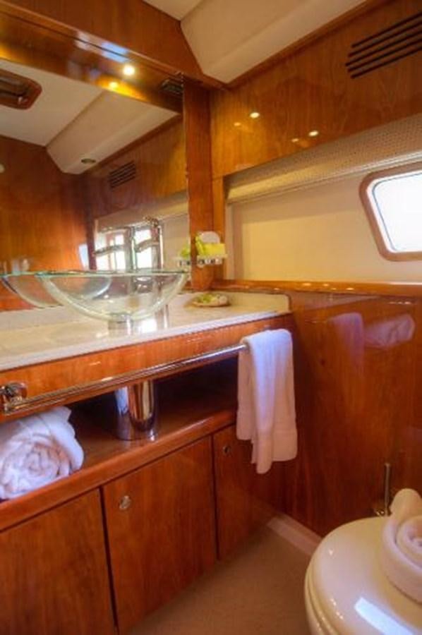 a kitchen with a glass sink aboard 74' PRIVILEGE 2010 Yacht for Sale