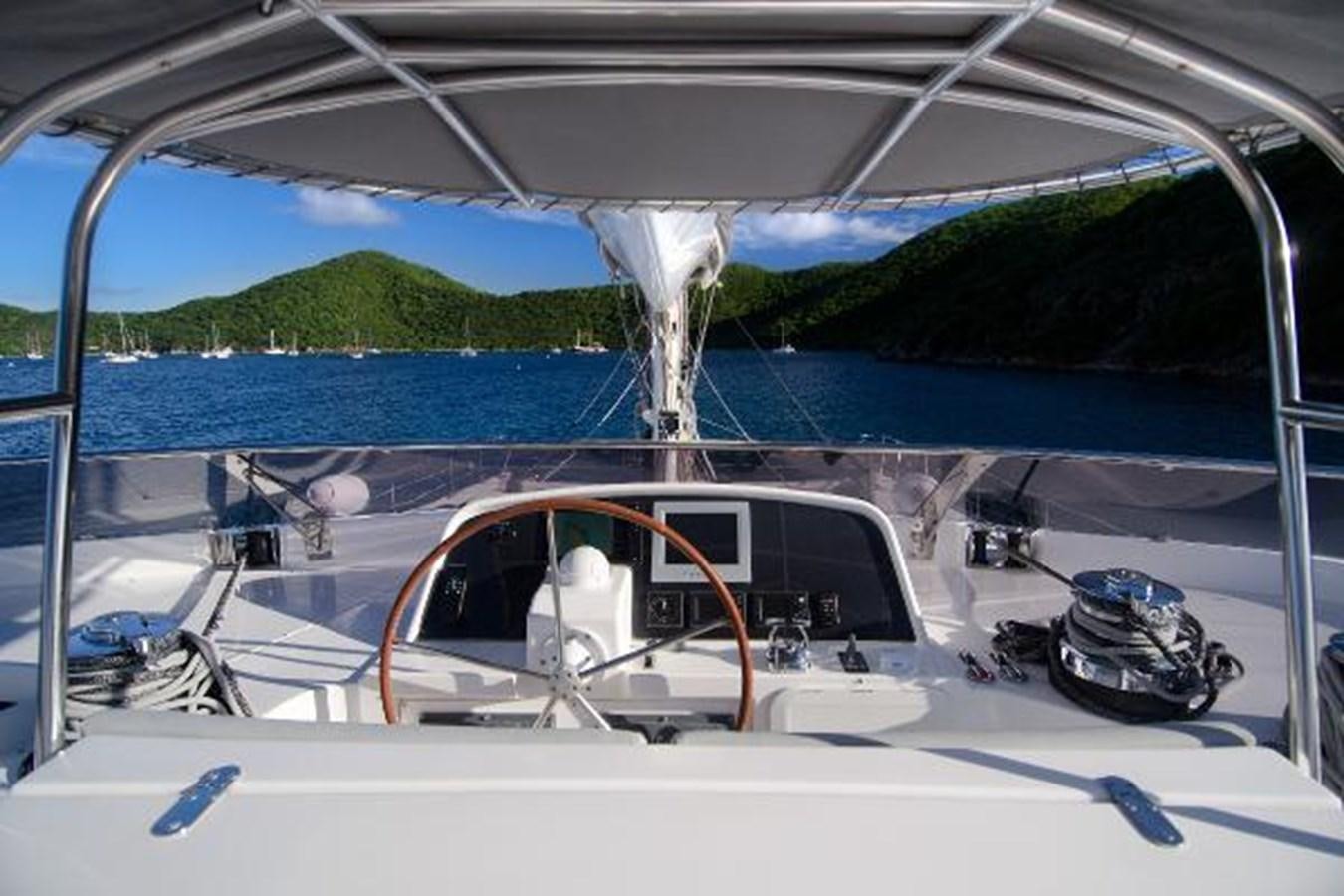 a boat with a view of the water and land below aboard 74' PRIVILEGE 2010 Yacht for Sale