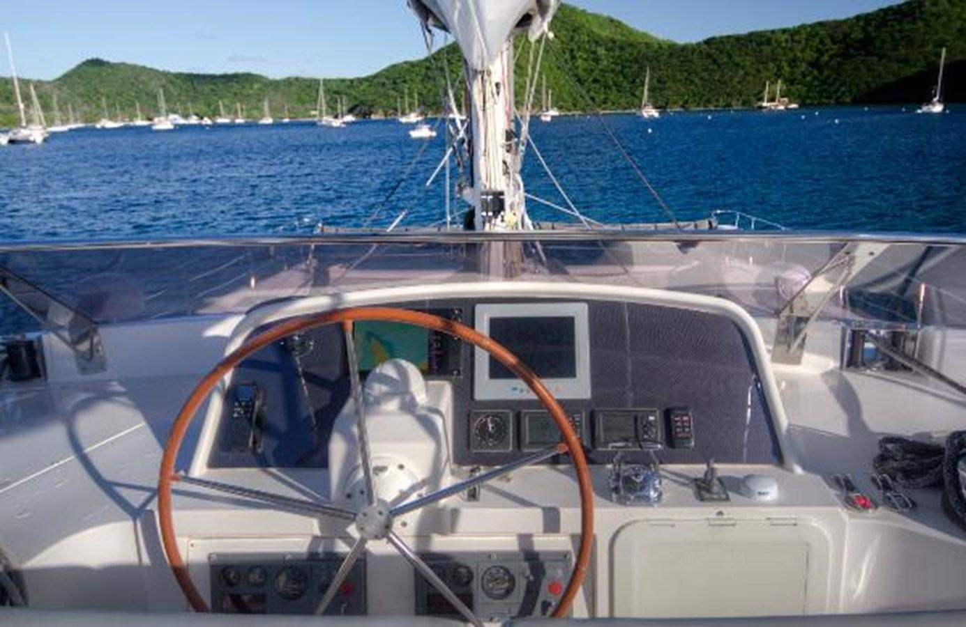 a boat with a steering wheel aboard 74' PRIVILEGE 2010 Yacht for Sale