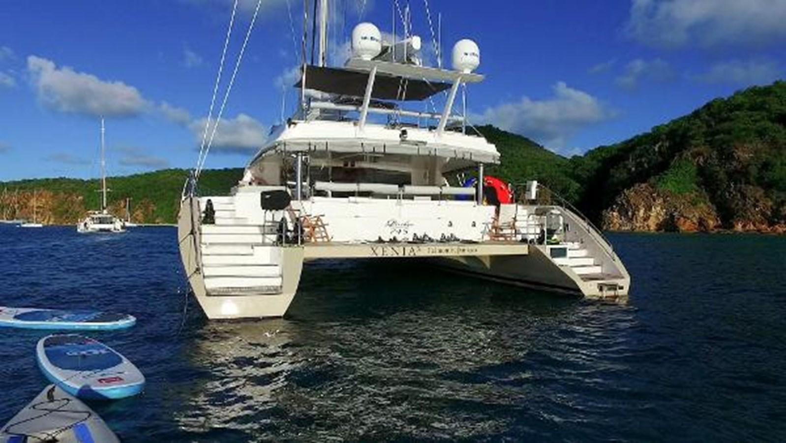 a white boat in the water aboard 74' PRIVILEGE 2010 Yacht for Sale