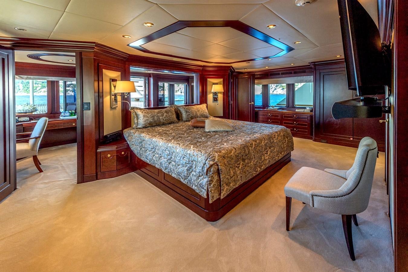 a large bedroom with a large bed aboard LIBERTA Yacht for Sale