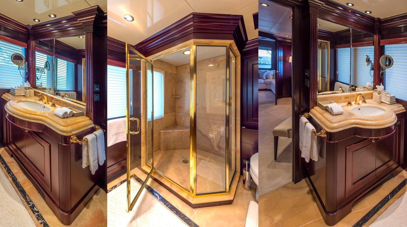 a bathroom with a large mirror aboard LIBERTA Yacht for Sale