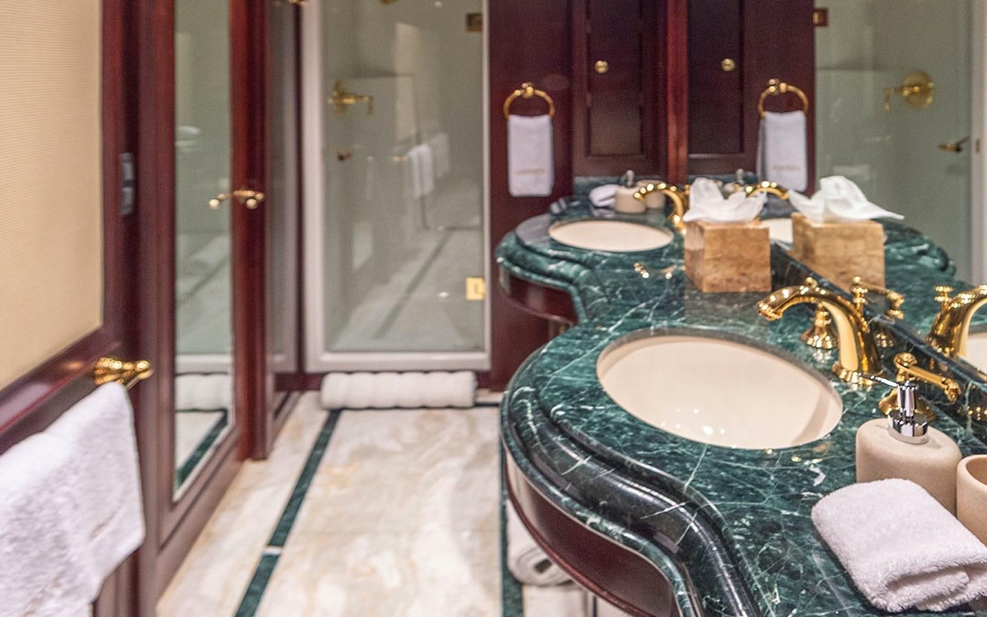 a bathroom with a sink and a mirror aboard LIBERTA Yacht for Sale