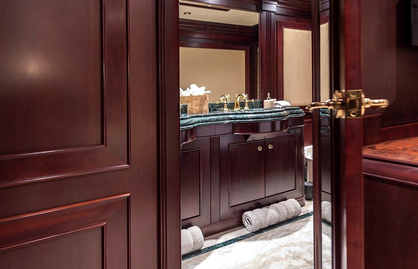 a bathroom with a sink and a mirror aboard LIBERTA Yacht for Sale