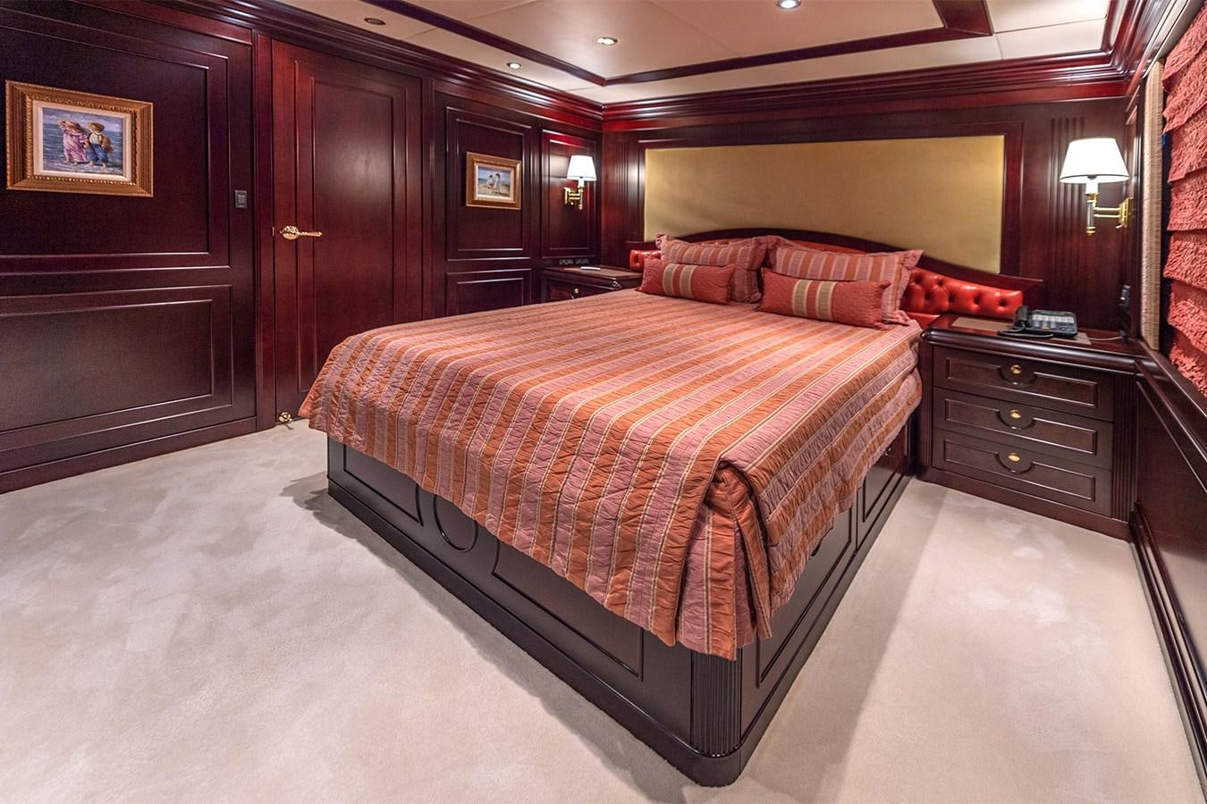 a large bed in a hotel room aboard LIBERTA Yacht for Sale