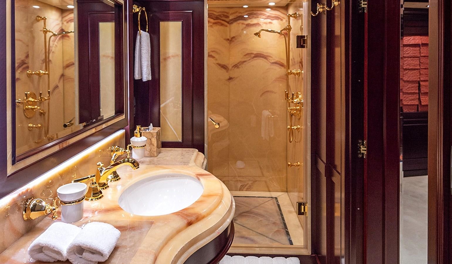 a bathroom with a sink and a shower aboard LIBERTA Yacht for Sale